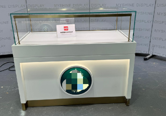 White & Gold Jewelry Display Counter with Circular Brand Accent
