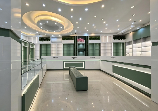 Modern Light Luxury Jewelry Store with Curved Showcase & Sleek White-Green Tones