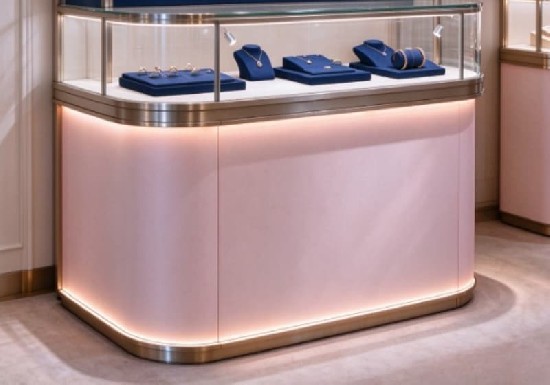 Soft Pink Curved Corner Jewelry Island Showcase With Brushed Metal Trim
